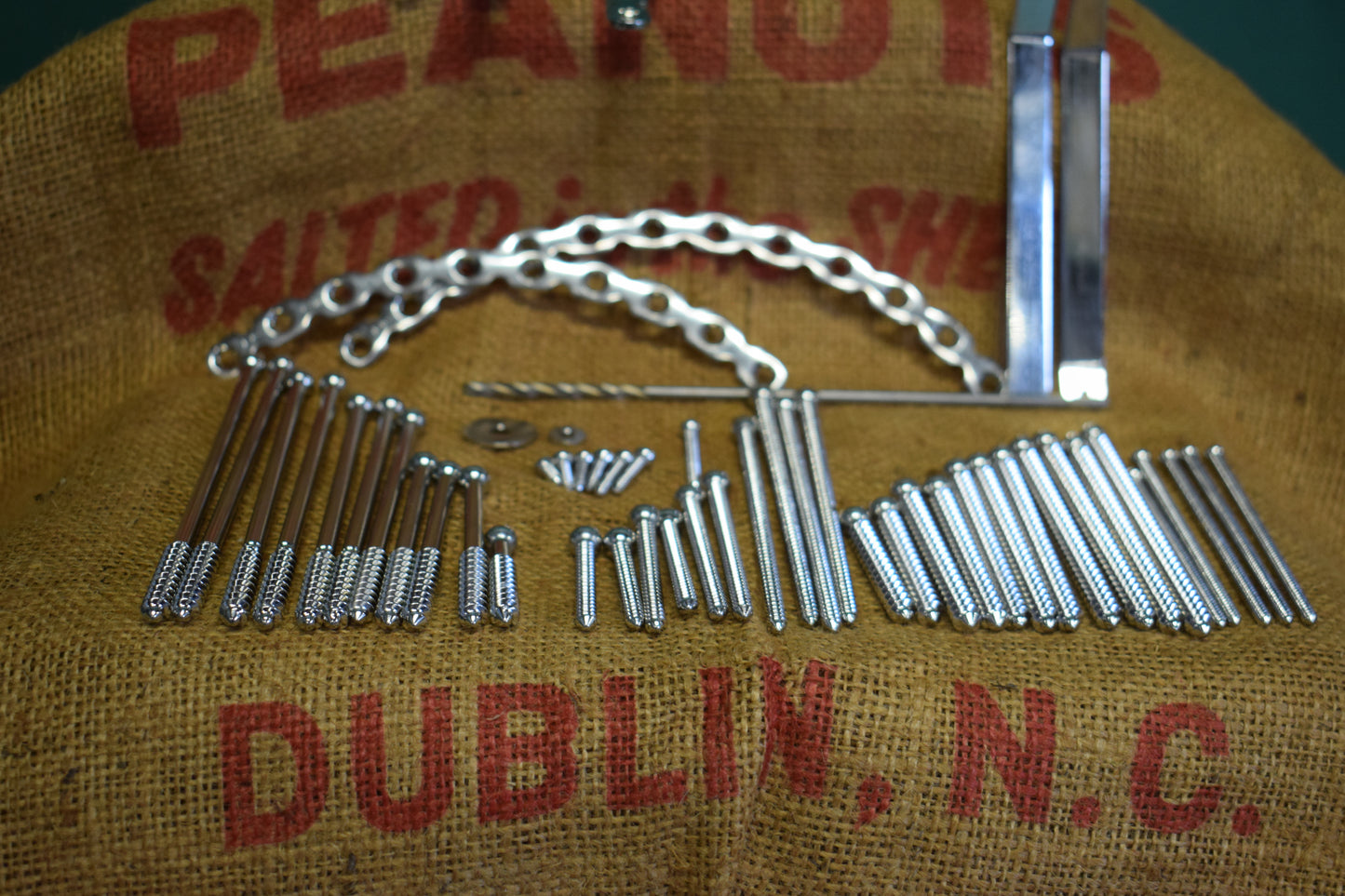 Assorted surgical screws, tools, fixators