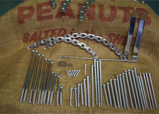 Assorted surgical screws, tools, fixators